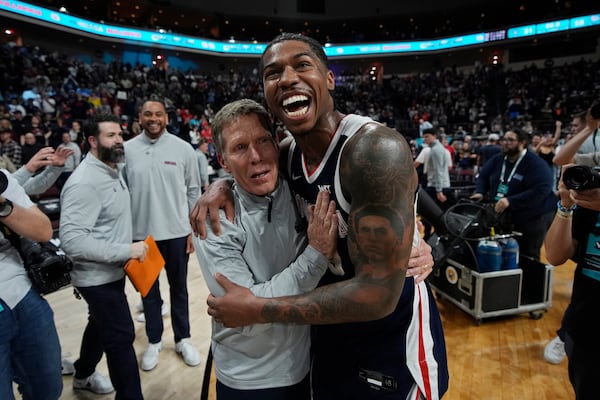 Gonzaga guard Khalif Battle, right, embraces head coach Mark Few after defeating Saint Mary's in an NCAA college basketball championship game in the West Coast Conference men's tournament Tuesday, March 11, 2025, in Las Vegas. (AP Photo/John Locher)