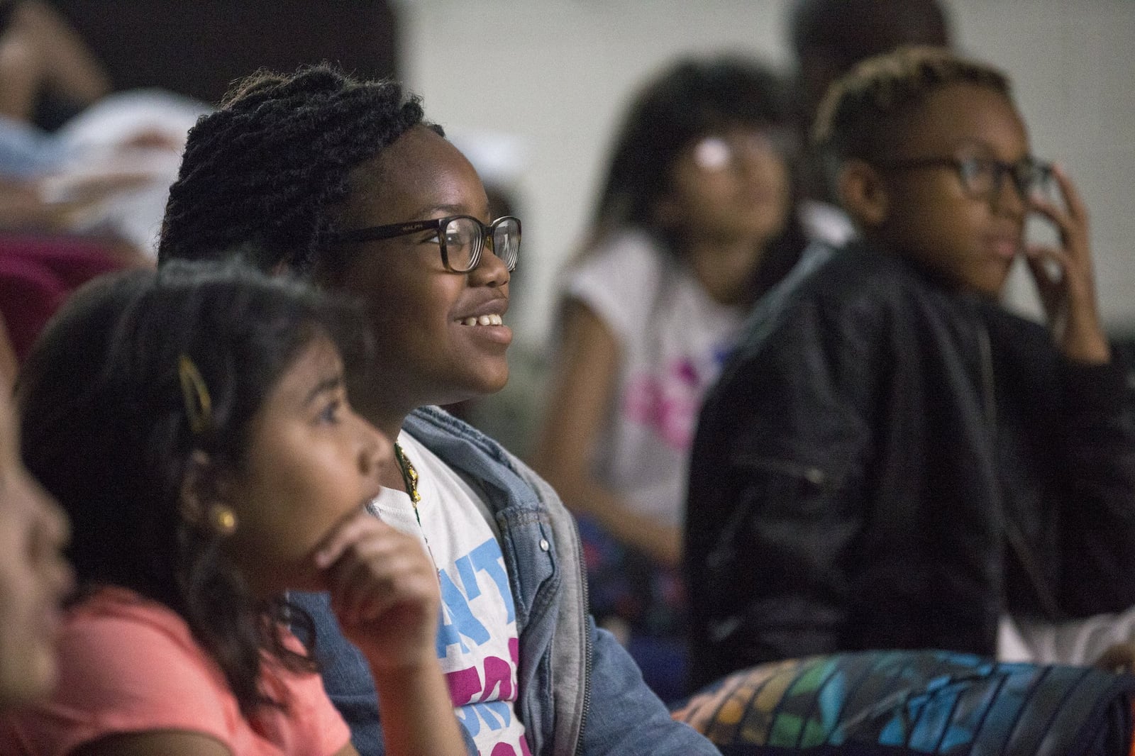 Fifth-graders at Mason Elementary school react while watching a short sci-fi film during the Kids with STEAM Film Festival. ALYSSA POINTER/ALYSSA.POINTER@AJC.COM