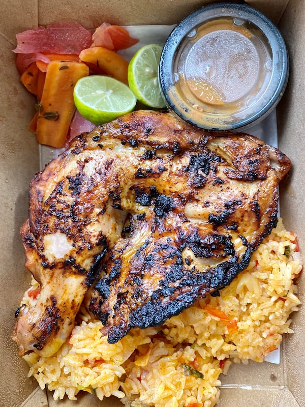 This takeout order from Gato includes: an adobo chicken quarter with seca soup rice, escabeche, salsa macha and key lime. Wendell Brock for The Atlanta Journal-Constitution