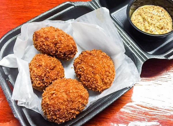 The Boudin Balls at the Po'Boy Shop are an excellent celebratory snack for Atlantans who want to enjoy some New Orleans flavor. CONTRIBUTED BY HENRI HOLLIS