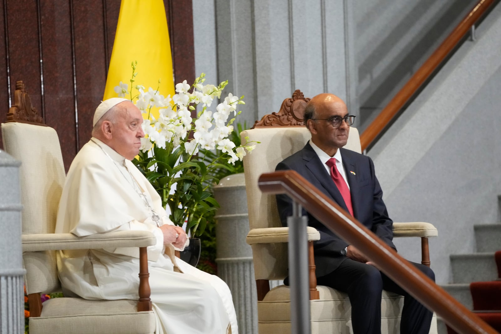 Pope Francis attends a welcome ceremony with the President of the Singapore Republic Tharman Shanmugaratnam, right, at the Parliament House in Singapore, Thursday, Sept. 12, 2024. Pope Francis flew to Singapore on Wednesday for the final leg of his trip through Asia, arriving in one of the world's richest countries from one of its poorest after a record-setting final Mass in East Timor. (AP Photo/Gregorio Borgia)