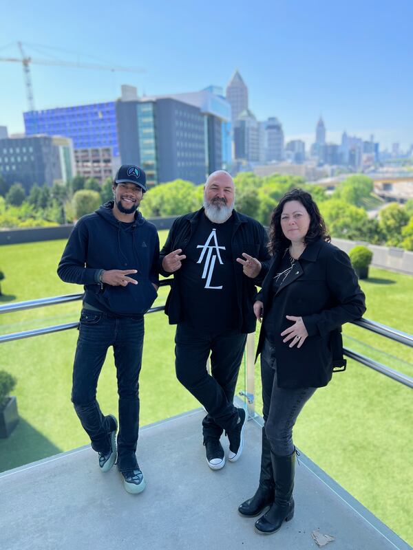 Muhammad Suber (from left), Joe Dreher and Krista M. Jones are part of the creative team behind the mural at the Midtown Union building.