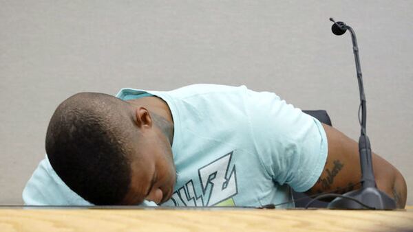 Joshua Brown, a neighbor of murder victim Botham Jean, is overcome with emotion Sept. 24, 2019, as he testifies at the trial of ex-Dallas police officer Amber Guyger. Brown, 28, was shot and killed outside his apartment Friday, Oct. 4, 2019.