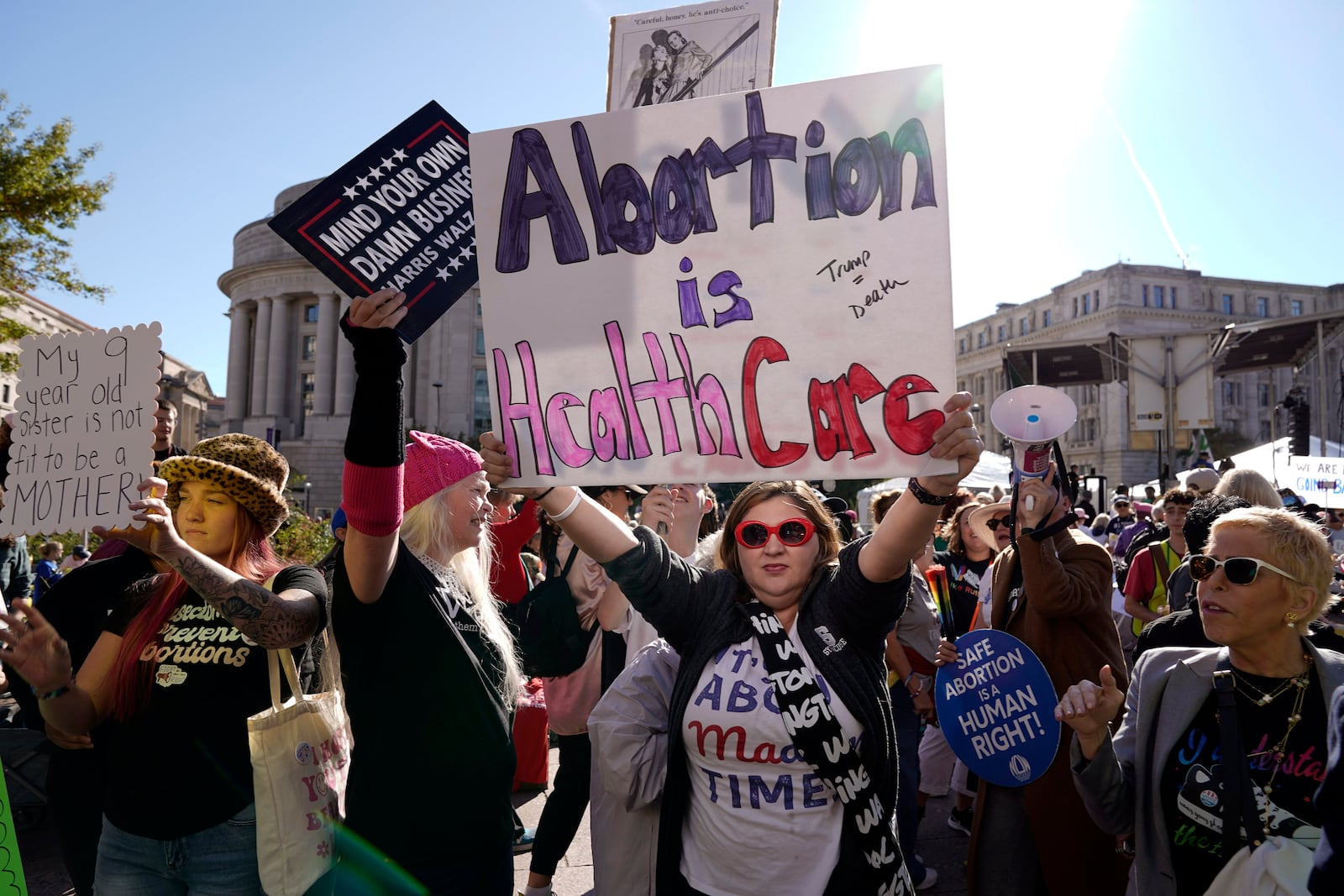 Demonstrator protest during the national Women's March at Freedom Plaza in Washington, Saturday, Nov. 2, 2024. (AP Photo/Jose Luis Magana)