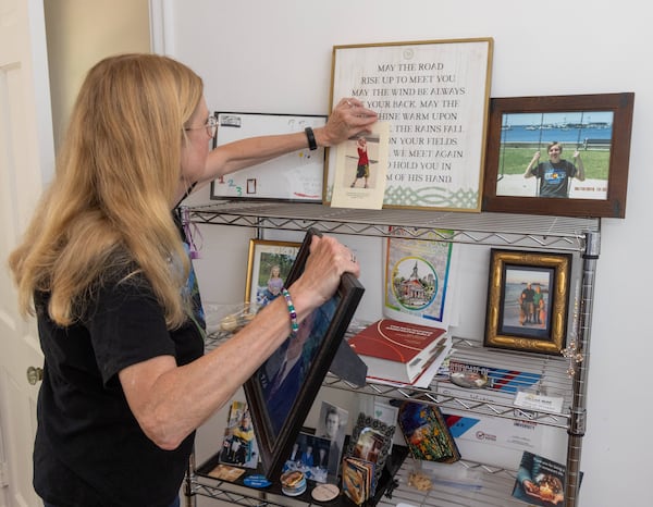 Sharon Winkler looks at photos of her son Alex in her Atlanta home.

PHIL SKINNER FOR THE ATLANTA JOURNAL-CONSTITUTION