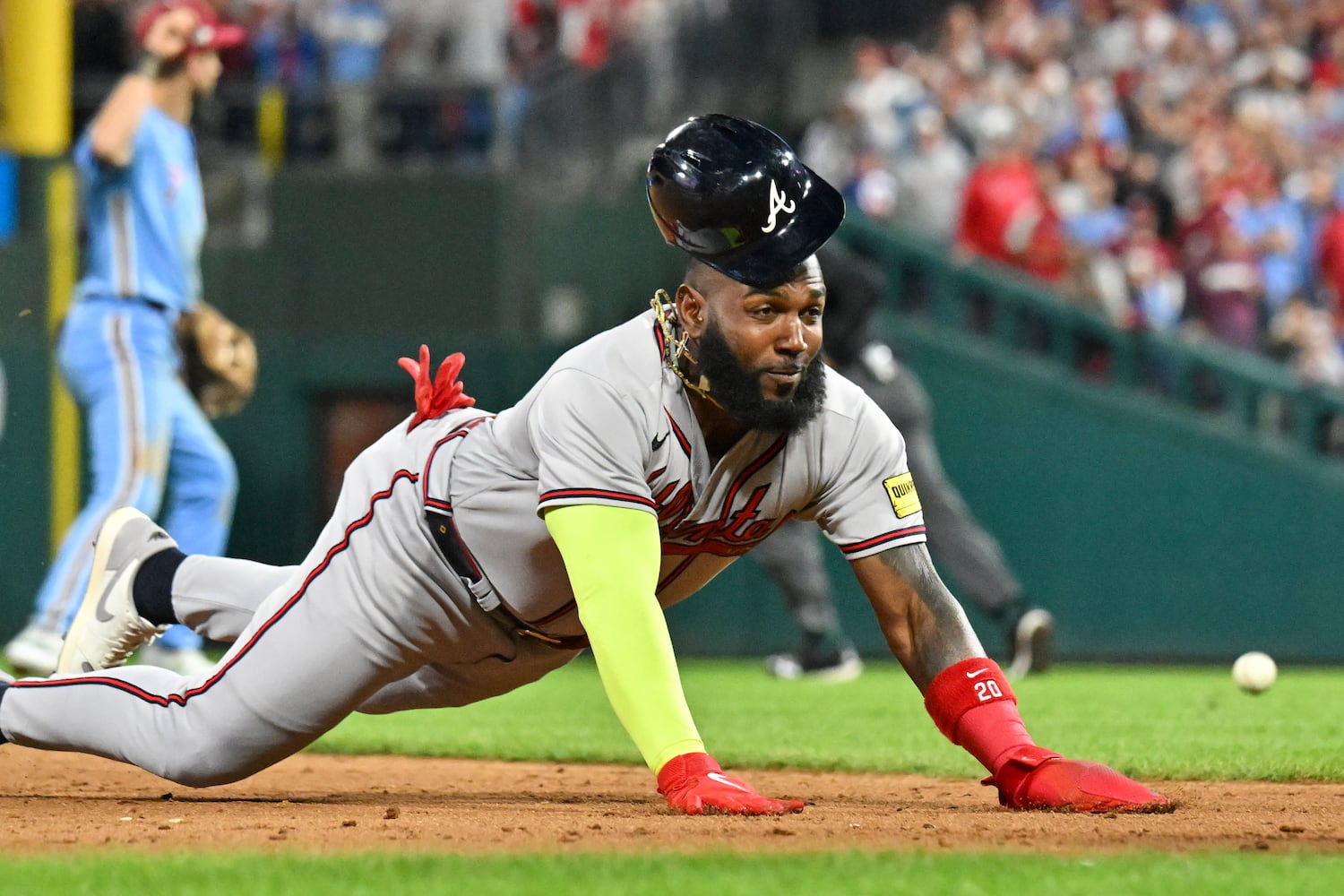 Atlanta Braves’ designated hitter Marcell Ozuna dives into third base after a single against the Philadelphia Phillies by Matt Olson during the ninth inning of NLDS Game 4 at Citizens Bank Park in Philadelphia on Thursday, Oct. 12, 2023.   (Hyosub Shin / Hyosub.Shin@ajc.com)