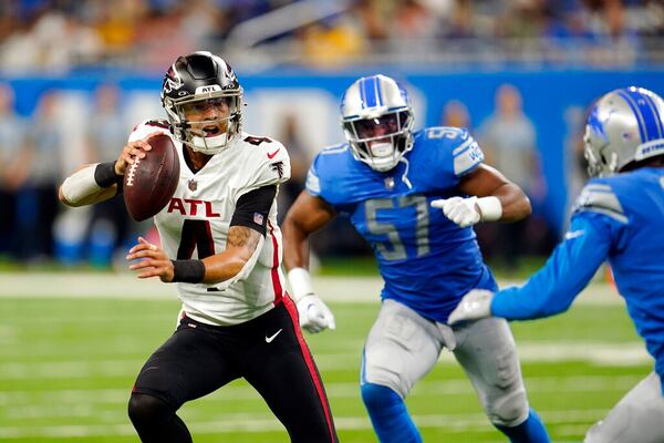 Atlanta Falcons quarterback Desmond Ridder (4) scrambles during the second half of a preseason NFL football game against the Detroit Lions, Friday, Aug. 12, 2022, in Detroit. (AP Photo/Paul Sancya)