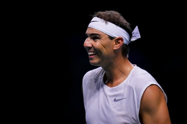 Spain's tennis player Rafael Nadal smiles during a training session at the Martin Carpena Sports Hall, in Malaga, southern Spain, on Saturday, Nov. 16, 2024. (AP Photo/Manu Fernandez)