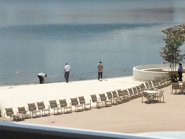 Investigators searched the beach area near where the attack occurred. Photo: Curtis Compton