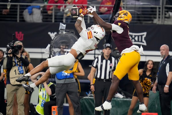 Iowa State defensive back Jeremiah Cooper (4) breaks up a pass intended for Arizona State wide receiver Xavier Guillory (1) in the second half of the Big 12 Conference championship NCAA college football game, in Arlington, Texas, Saturday Dec. 7, 2024. (AP Photo/Julio Cortez)