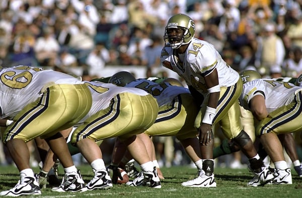 1 Jan 1999: Joe Hamilton #14 of the Georgia Tech Yellow Jackets calls from the line of scrimmage during the Toyota Gator Bowl against the Notre Dame Fighting Irish at Alltel Stadium in Jacksonville, Florida. Georgia Tech defeated Notre Dame 35-28. Mandatory Credit: Craig Jones /Allsport