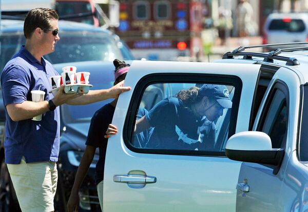 Sasha Obama, daughter of President Barack Obama, departs Nancy's Restaurant after working her shift there, in Oak Bluffs, Mass., on the island of Martha's Vineyard. (Boston Herald, Christopher Evans via AP)