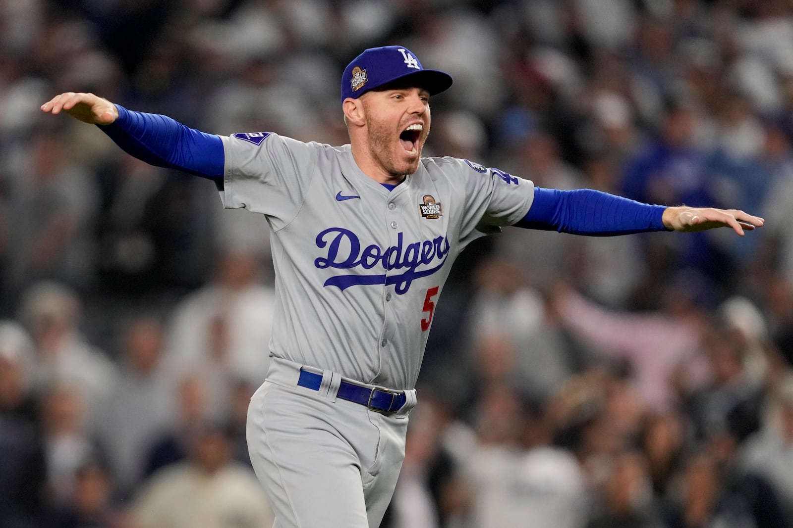 Los Angeles Dodgers first baseman Freddie Freeman celebrates their win against the New York Yankees in Game 5 to win the baseball World Series, Wednesday, Oct. 30, 2024, in New York. (AP Photo/Ashley Landis)