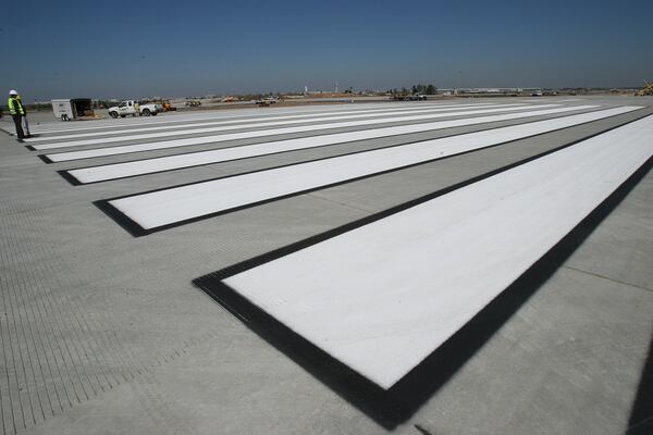 060322 - HAPEVILLE, GA -- These giant painted lines can be seen at the construction site on the fifth runway at Hartsfield Jackson Atlanta International Airport on Wednesday, March 22, 2006. (JOHNNY CRAWFORD/AJC staff)