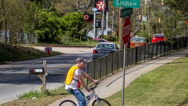 Bob Gilman looks over the intersection of Bouldercrest Road and Cecilia Drive Southeast where a Sunday night drive-by shooting resulted in the death of a 3-year-old boy in Atlanta. STEVE SCHAEFER / SPECIAL TO THE AJC