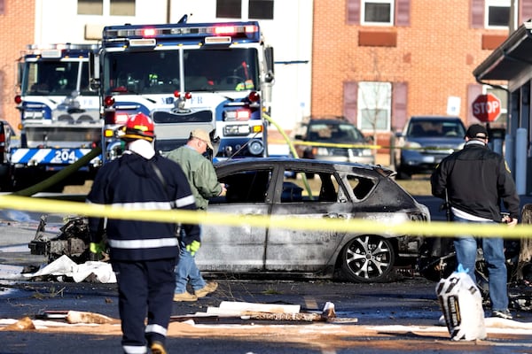 A plane crashed in a parking lot of a Manheim Township, Pa., retirement community, less than a mile south of Lancaster Airport, Sunday, March 9, 2025. (Zach Gleiter/The Patriot-News via AP)