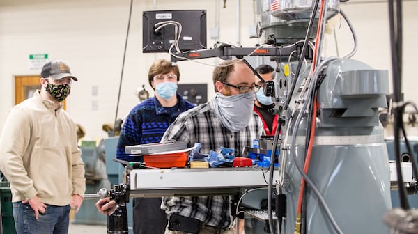 Georgia Northwestern Technical College in Rome, GA continues conducting classes, including precision machining and manufacturing labs, with smaller groups to allow for COVID-19 social distancing and with remote learning when possible Tuesday, Jan 26, 2021.  Instructor Bart Jenkins demonstrates a few basics for a class of new students in their first semester.  (Jenni Girtman for The Atlanta Journal-Constitution)