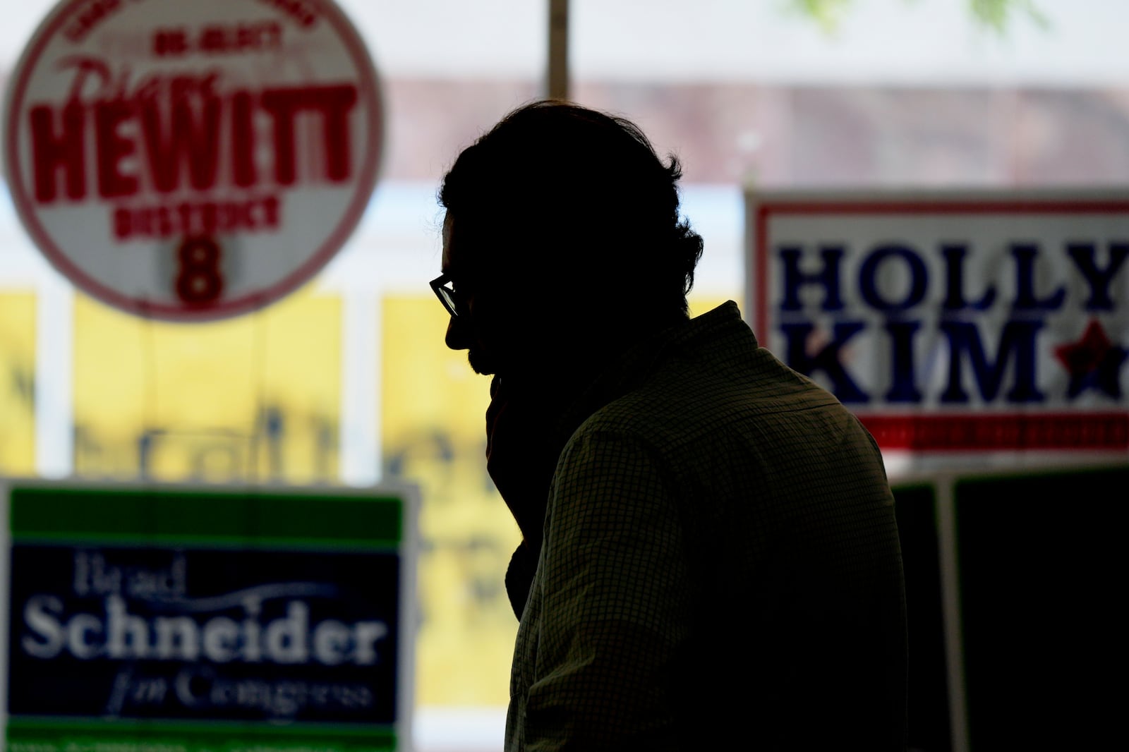 Matt Muchowkshi, chair of the Waukegan Township Democrats, looks around at the Waukegan Township Democrats office in Waukegan, Ill., Monday, Sept. 16, 2024. (AP Photo/Nam Y. Huh)