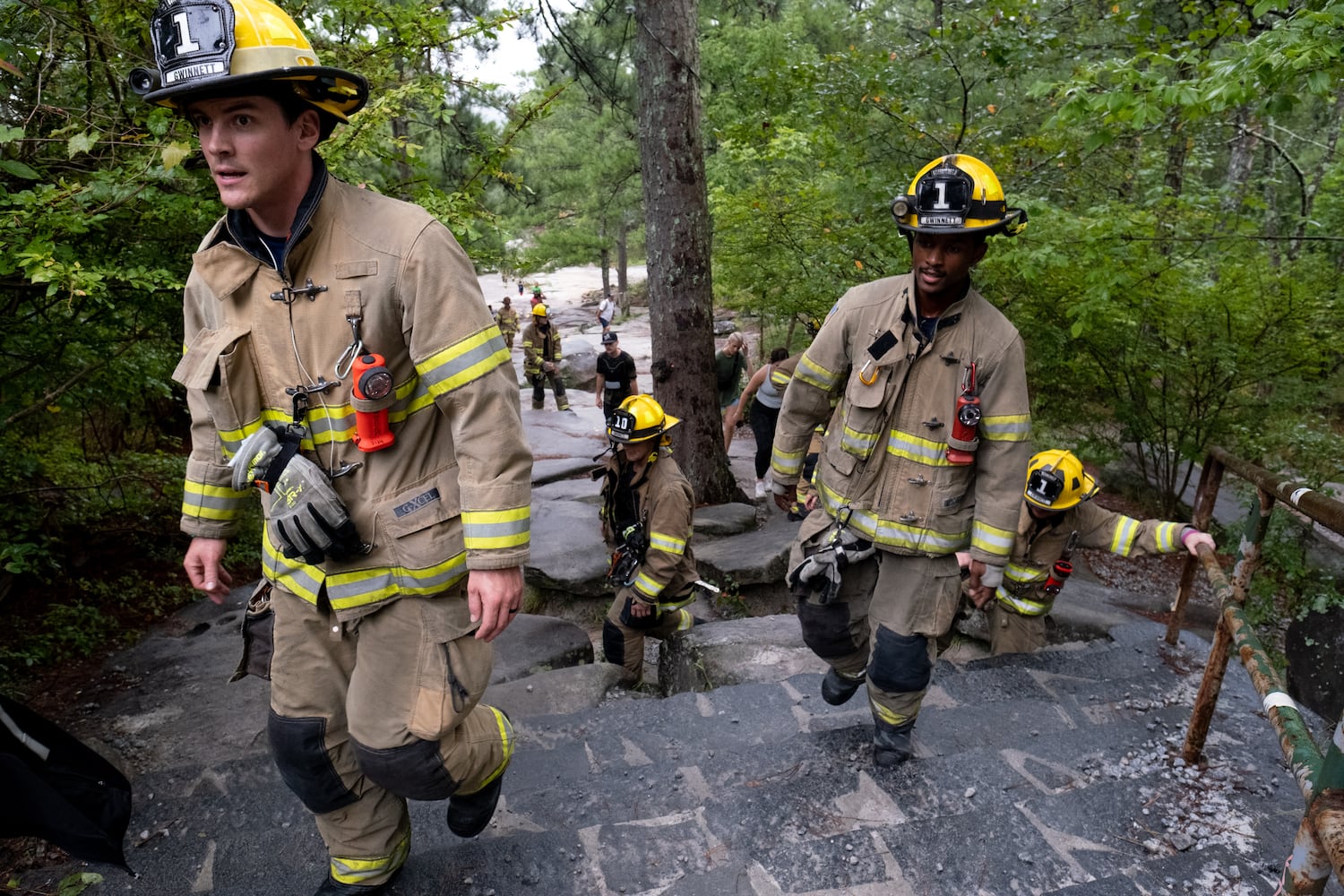 Firefighters climb Stone Mountain on Sunday morning, Sept. 11, 2022, during the annual remembrance of the 9/11 terrorist attacks. (Photo: Ben Gray for The Atlanta Journal-Constitution)