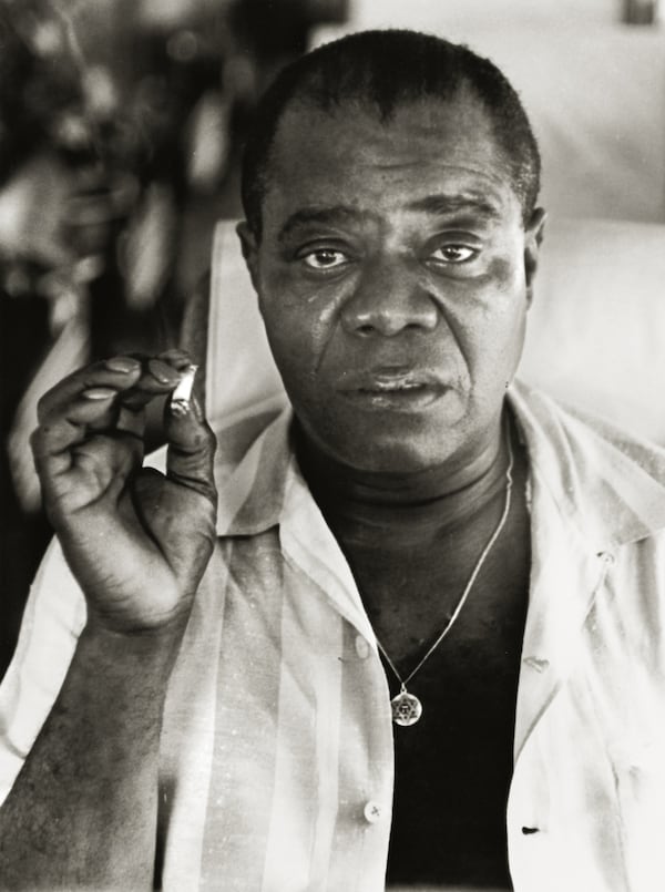 In a photo from 1960, Herb Snitzer captures a private moment with Louis Armstrong on the bus to the Tanglewood music venue. Photo: Herb Snitzer