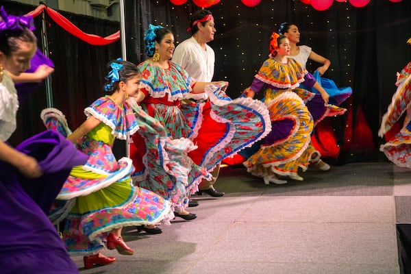 Performers dance on stage during the Gwinnett County's annual Quince Girl Expo at Best friends Park Sunday, March 20, 2022.  STEVE SCHAEFER FOR THE ATLANTA JOURNAL-CONSTITUTION