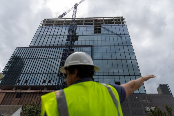 Travis Garland, managing director of Portman Holdings, gives a tour of Spring Quarter, one of the few office high-rises under construction in metro Atlanta, in Midtown on Tuesday, May 7, 2024. (Arvin Temkar / AJC)