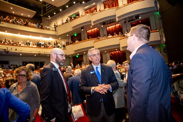 Thousands of Israel supporters, including Georgia Secretary of State Brad Raffensperger, center, gather inside and outside of City Springs in Sandy Springs on Tuesday, Oct 10, 2023 for a rally for Israel.  (Jenni Girtman for The Atlanta Journal-Constitution)