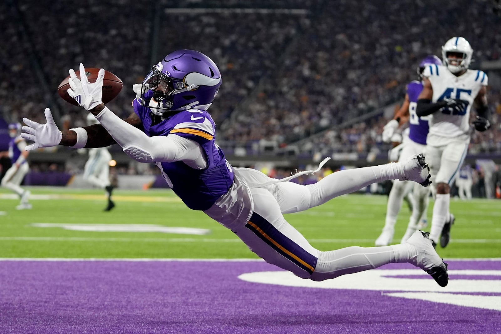 Minnesota Vikings wide receiver Jordan Addison (3) catches a 4-yard touchdown pass during the second half of an NFL football game against the Indianapolis Colts, Sunday, Nov. 3, 2024, in Minneapolis. (AP Photo/Abbie Parr)