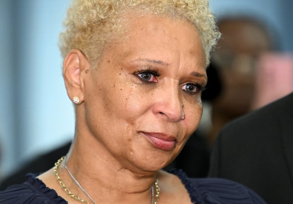 Jonia Milburn, mother of Christon Collins, can’t hide her emotions as she speaks to members of the press during a press conference on Tuesday, August 6, 2024 in Atlanta. The family of Christon Collins hold a press conference with attorney Ben Crump. Collins, a veteran, was found dead in the DeKalb County Jail on March 13. His mother has obtained video footage that shows her son was lying on the floor for hours before jail staff responded. (Hyosub Shin / AJC)