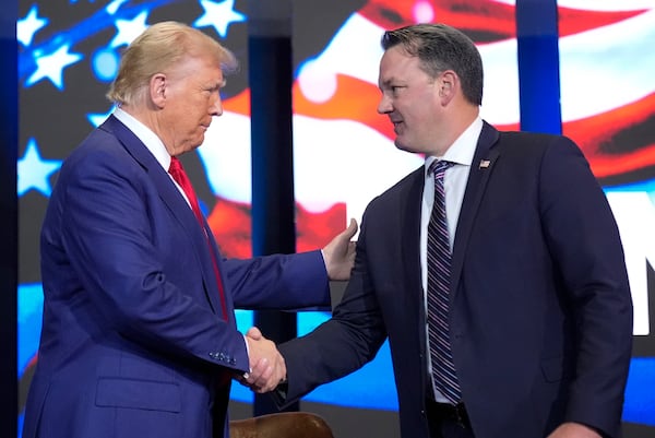 Georgia Lt. Gov. Burt Jones (right), a presence at many Donald Trump rallies in the state this year, is thought to be eyeing a run for governor. 