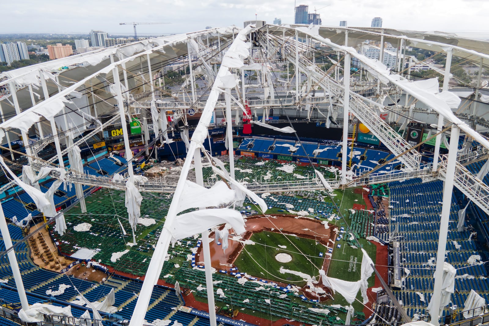 The roof of the Tropicana Field is damaged the morning after Hurricane Milton hit the region, Thursday, Oct. 10, 2024, in St. Petersburg, Fla. (AP Photo/Julio Cortez)