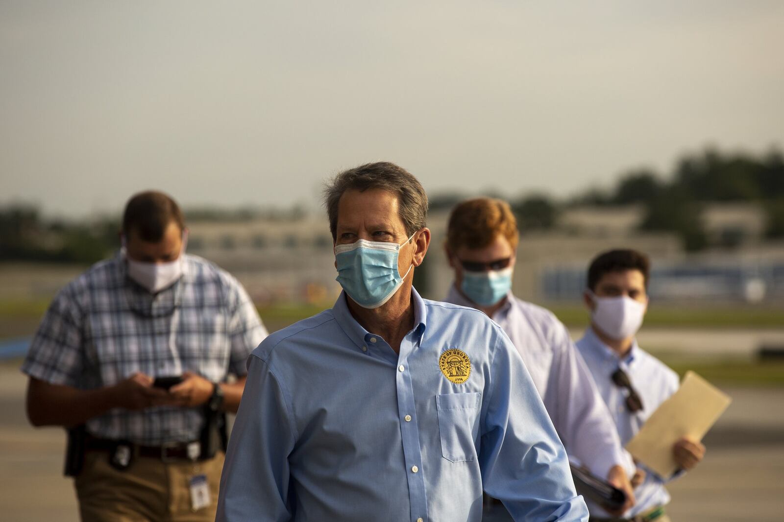 Georgia Gov. Brian Kemp prepares to speak at the Peachtree Dekalb Airport in Atlanta.REBECCA WRIGHT FOR THE ATLANTA JOURNAL-CONSTITUTION