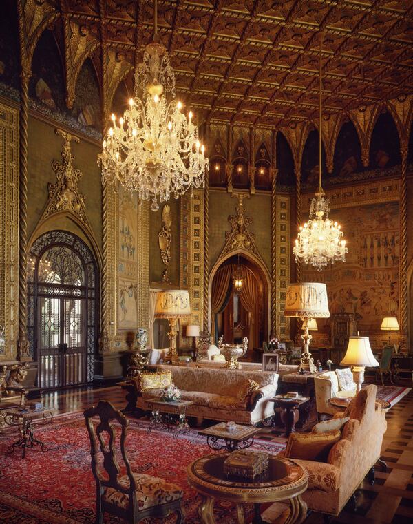 Mar-a-Lago’s gilded living room, as it appeared in 1993 after Donald and Ivana Trump restored the mansion to its original glory. Marjorie Merriweather Post’s original furniture, tapestries and art objects are organized the way Post displayed them while she was still alive. The 42-foot ceiling is a copy of the “Thousand-Wing ceiling” in Venice’s Accademia. Photo / C.J. Walker