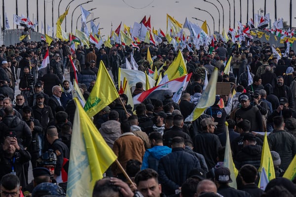 Shiite Iraqis attend the funeral ceremony of Lebanon's Hezbollah leader Sayyed Hassan Nasrallah, who was killed by an Israeli airstrike in Beirut, during a symbolic funeral in Baghdad, Iraq, Sunday, Feb. 23, 2025. (AP Photo/Hadi Mizban)