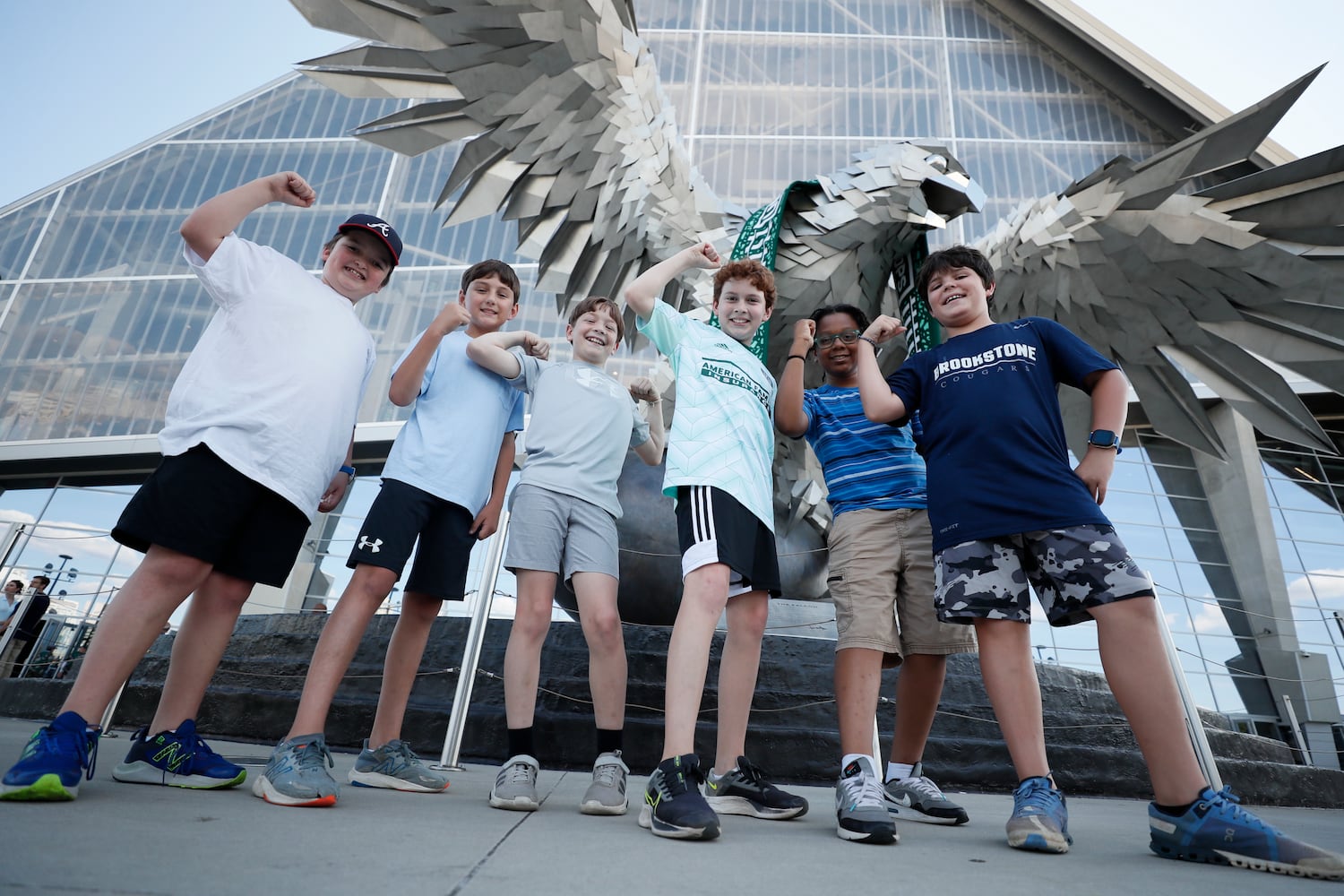 Kids from Brooke Stone School in Columbus, Ga, react in front of the Falcon at the Mercedes-Benz Stadium before the game against the Columbus Crew on Saturday, May 28, 2022. Miguel Martinez / miguel.martinezjimenez@ajc.com