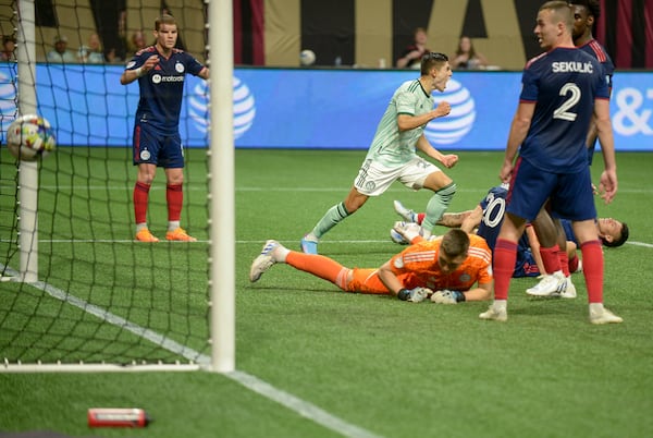 Defender Brooks Lennon (11) kicks Atlanta United’s fourth and final goal against Chicago Fire FC Saturday, May 7, 2022 at the Mercedez-Benz Stadium. (Daniel Varnado/For the Atlanta Journal-Constitution)