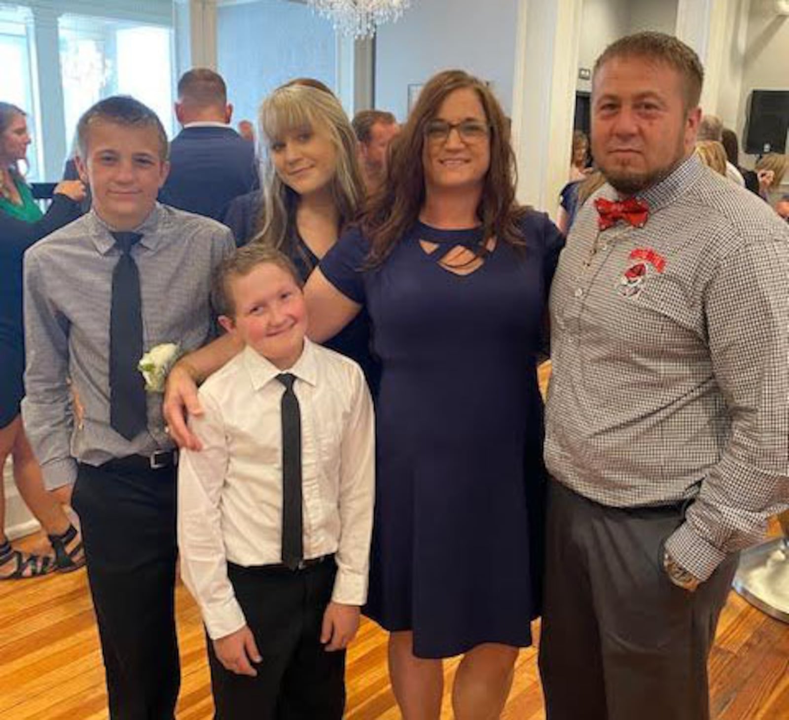 The Tanner family of Atkinson has battled childhood cancer for years. 16-year-old Gage, second from left, was diagnosed as a child with a brain tumor. And although drugs have stabilized the tumor, Gage's parents Candace and Michael, at right, have been left with significant expenses. (Contributed photo)