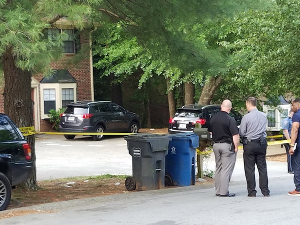 Investigators have taped off the parking lot to a townhouse complex on Patterson Circle.