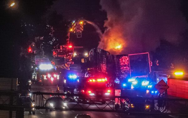 Authorities worked to extinguish a tractor-trailer fire that shut down the eastbound lanes of I-285 for hours Monday morning in Dekalb County.