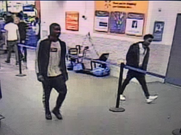 Investigators said the two teenage suspects hit a pedestrian while fleeing the Walmart parking lot.