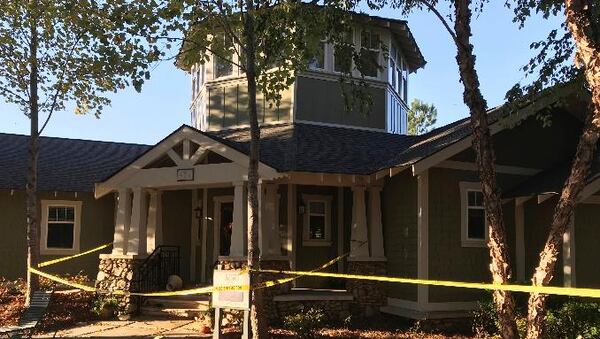 Police tape surrounds an apartment complex after a floor collapsed early Sunday during a party in Clemson, South Carolina,