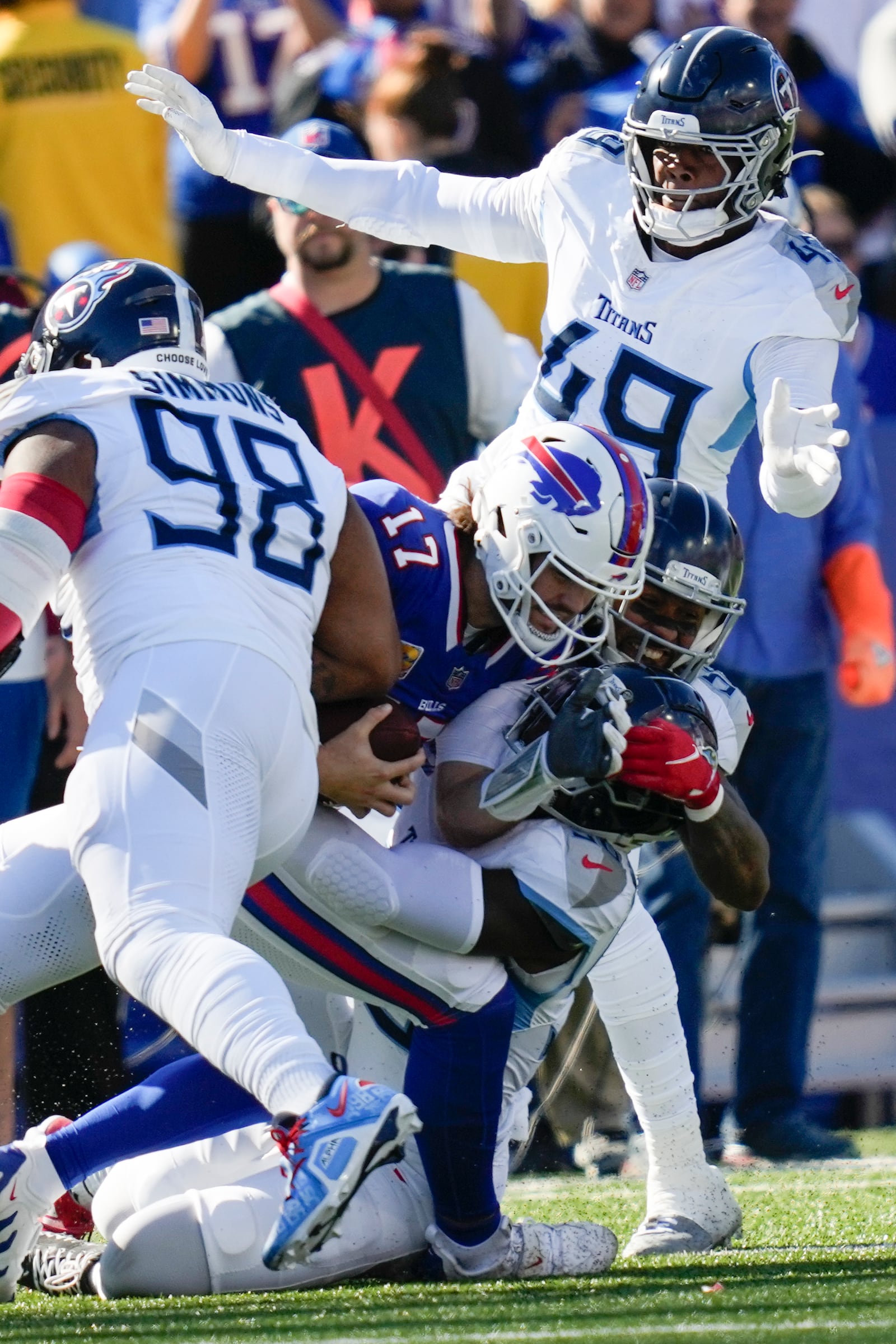 Buffalo Bills quarterback Josh Allen (17) is tackled by the Tennessee Titans defense during the first half of an NFL football game Sunday, Oct. 20, 2024, in Orchard Park, N.Y. (AP Photo/Charles Krupa)