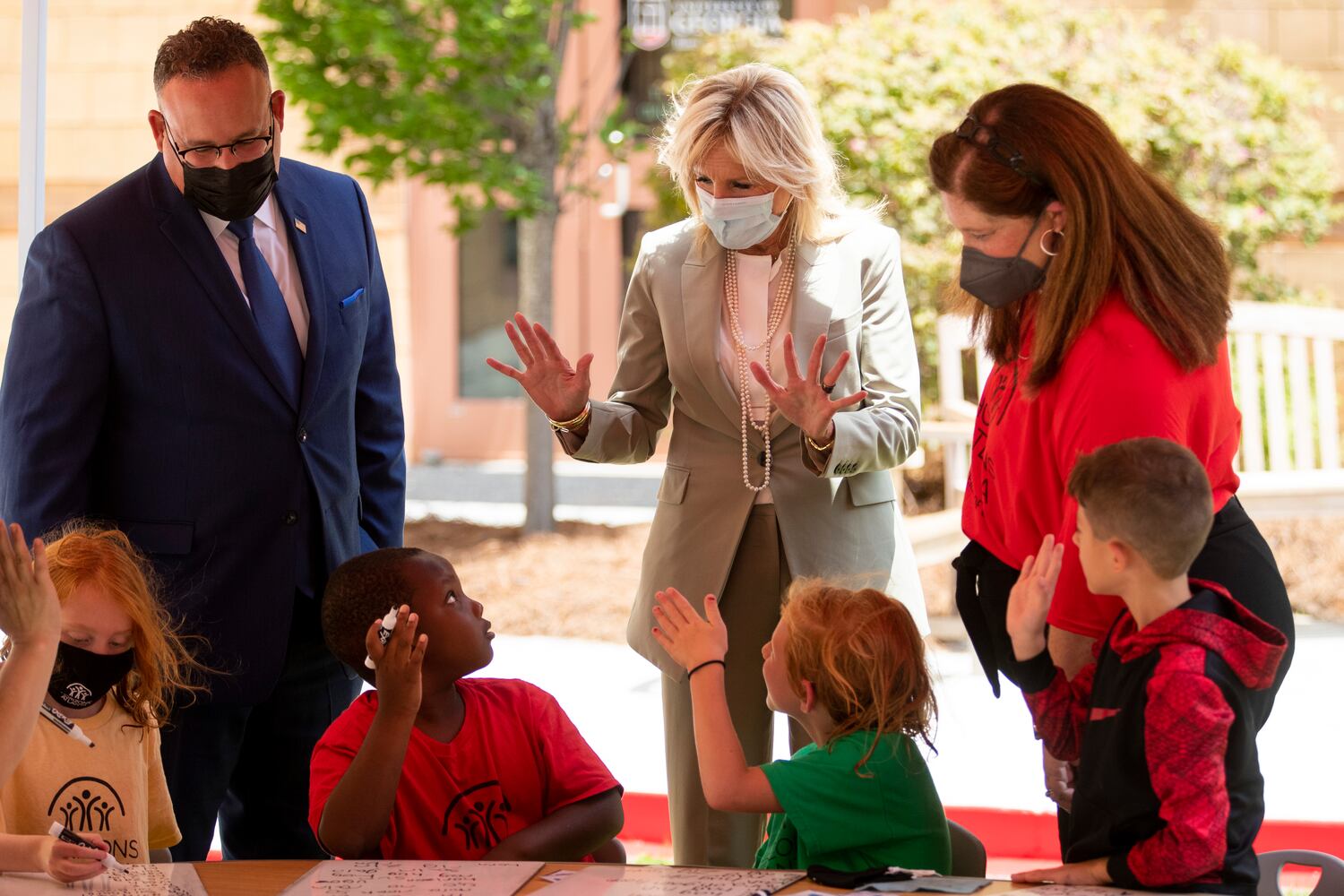 First Lady Jill Biden and Education Secretary Miguel Cardona say hello to first-grade students while visiting a Horizons Atlanta summer learning program at the University of Georgia in Athens, Georgia on Thursday, July 21, 2022. The program serves students from Barnett Shoals Elementary School. (Chris Day/Christopher.Day@ajc.com)