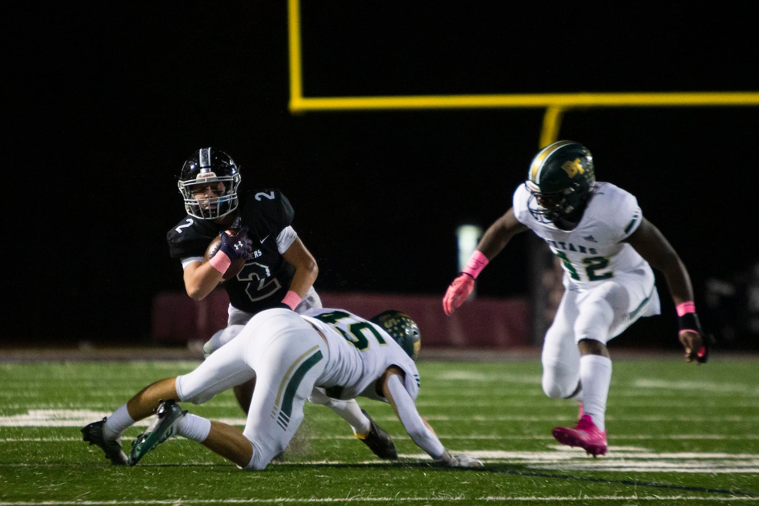 Jake Gil, running back for Alpharetta, gets tackled by John Winter, outside linebacker for Blessed Trinity, during the Alpharetta vs. Blessed Trinity high school football game on Friday, October 28, 2022, at Alpharetta high school in Alpharetta, Georgia. Alpharetta led Blessed Trinity 21-7 at the end of the first half.