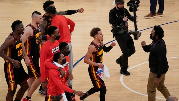 Atlanta Hawks' Trae Young (11) and the rest of team celebrate after Game 1 win in first-round playoff series against the New York Knicks, Sunday, May 23, 2021, in New York. The Hawks won 107-105. (Seth Wenig/AP)