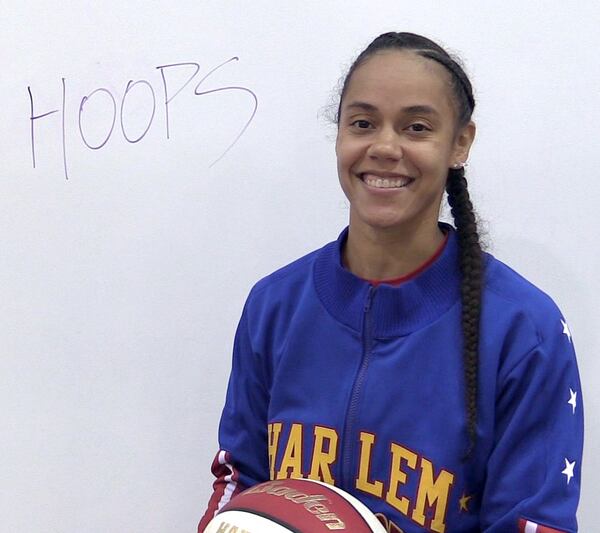 Briana Green, known as “Hoops Green,” is one of four women on the Harlem Globetrotters. WILLIAM THWEATT / WILLIAM.THWEATT@COXINC.COM