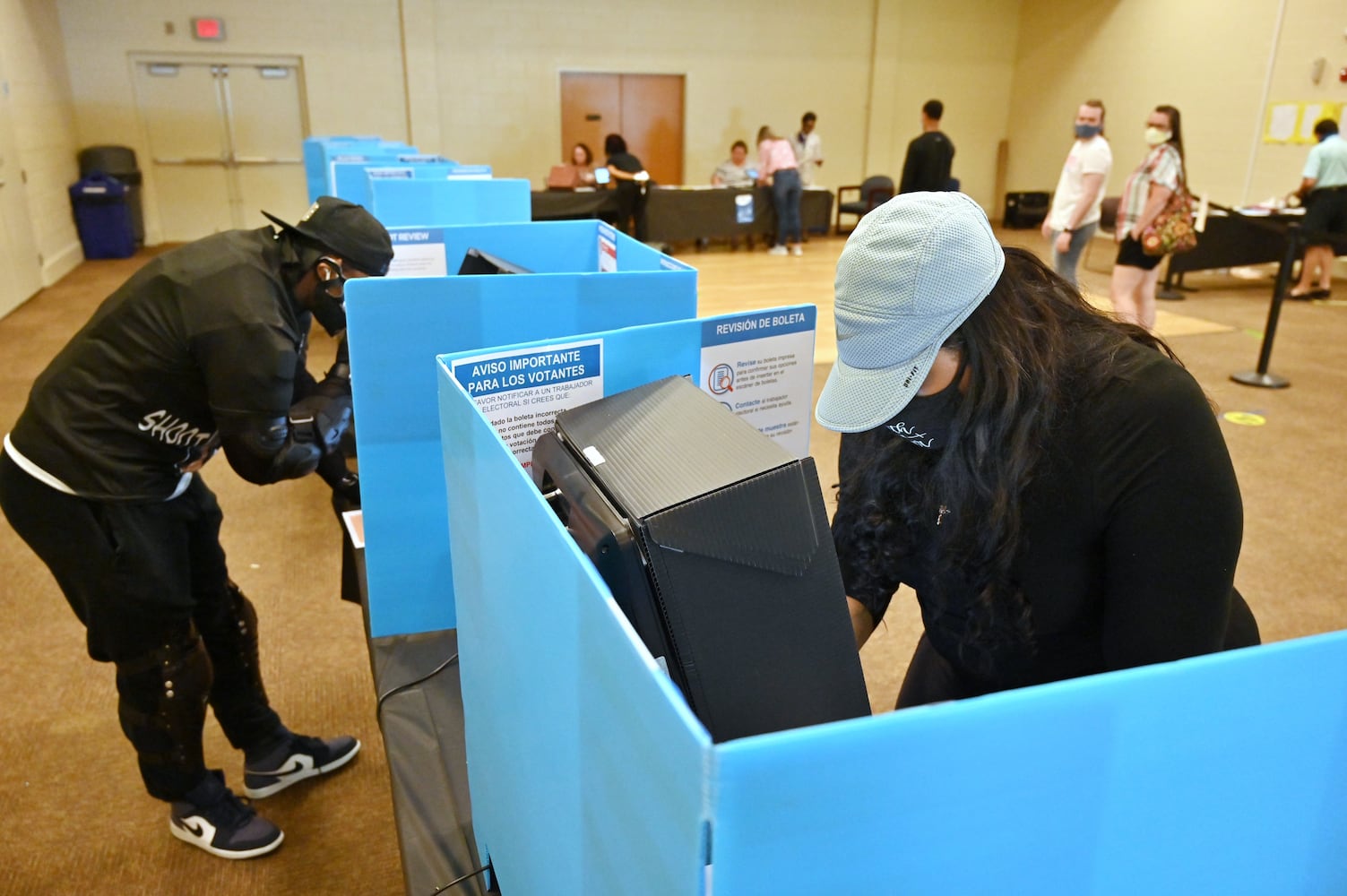 PHOTOS: Georgia voters struggle with long lines, new equipment, social distancing