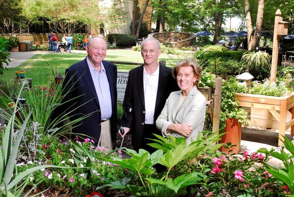 From left, Harold Shepherd, his son James, whose injury helped spark the founding of the Shepherd Center, and Alana Shepherd outside the center.