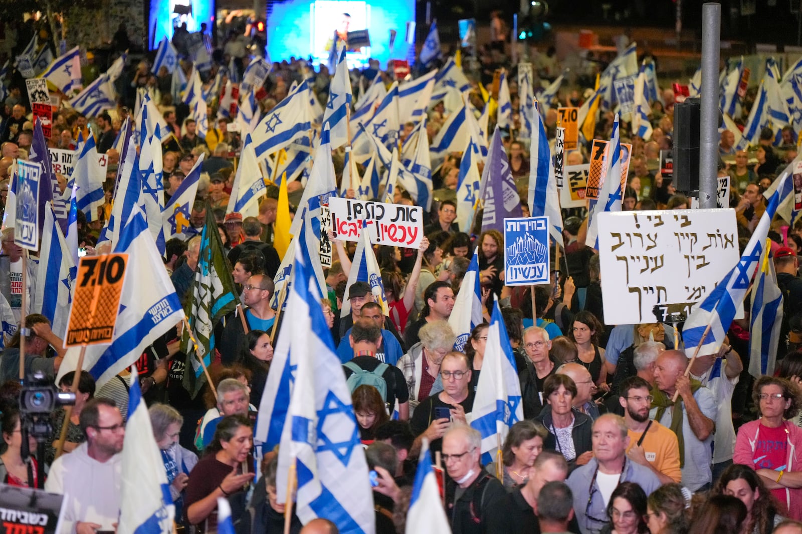 People protest against Prime Minister Benjamin Netanyahu's government and call for the release of hostages held in the Gaza Strip by the Hamas militant group, in Jerusalem, Monday, Oct. 28, 2024. (AP Photo/Ohad Zwigenberg)