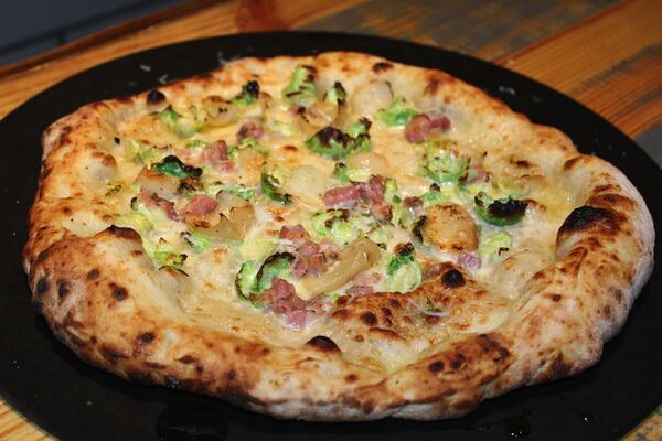 Brussels sprouts , fontina, pancetta , and cipollini pizza.